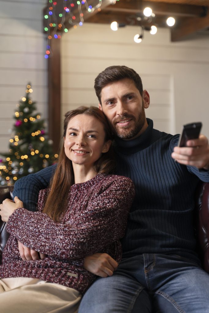 man-woman-watching-tv-christmas